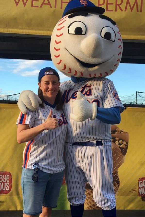 A New York Mets fan gives the thumbs-up as Met and New York